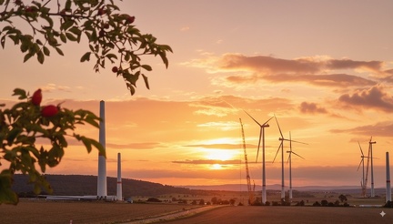 KI generated-Windräder Sonnenuntergang Ahlum